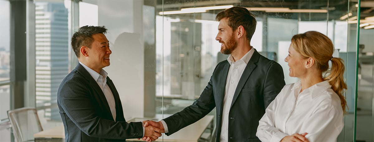 Business professionals are actively engaging in a handshake